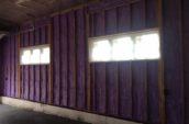 purple spray foam insulation in garage wall with windows
