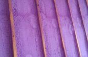 purple spray foam insulation in wall detail