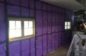 purple spray foam insulation covering wall of garage