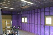 purple spray foam insulation covering walls of garage