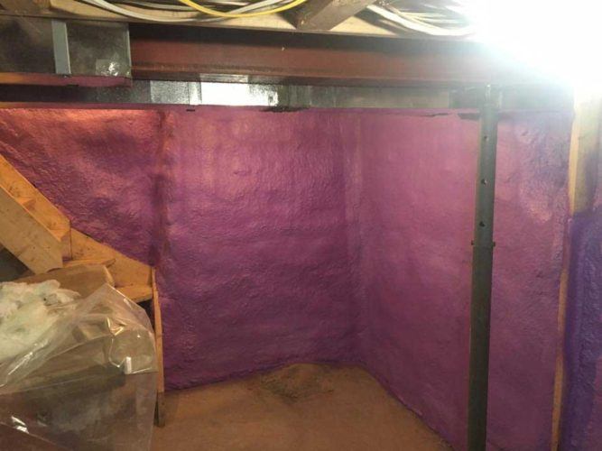 purple spray foam insulation covering walls of basement