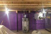 purple spray foam insulation covering walls of basement