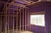 purple spray foam insulation covering walls in house