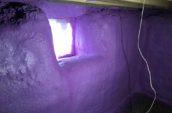purple spray foam insulation covering basement walls