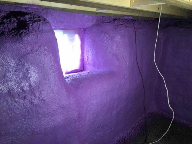purple spray foam insulation covering basement walls