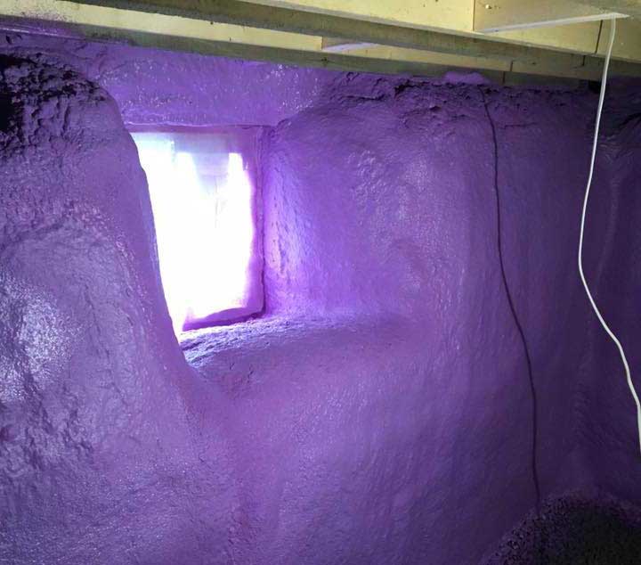 purple spray foam insulation covering basement walls