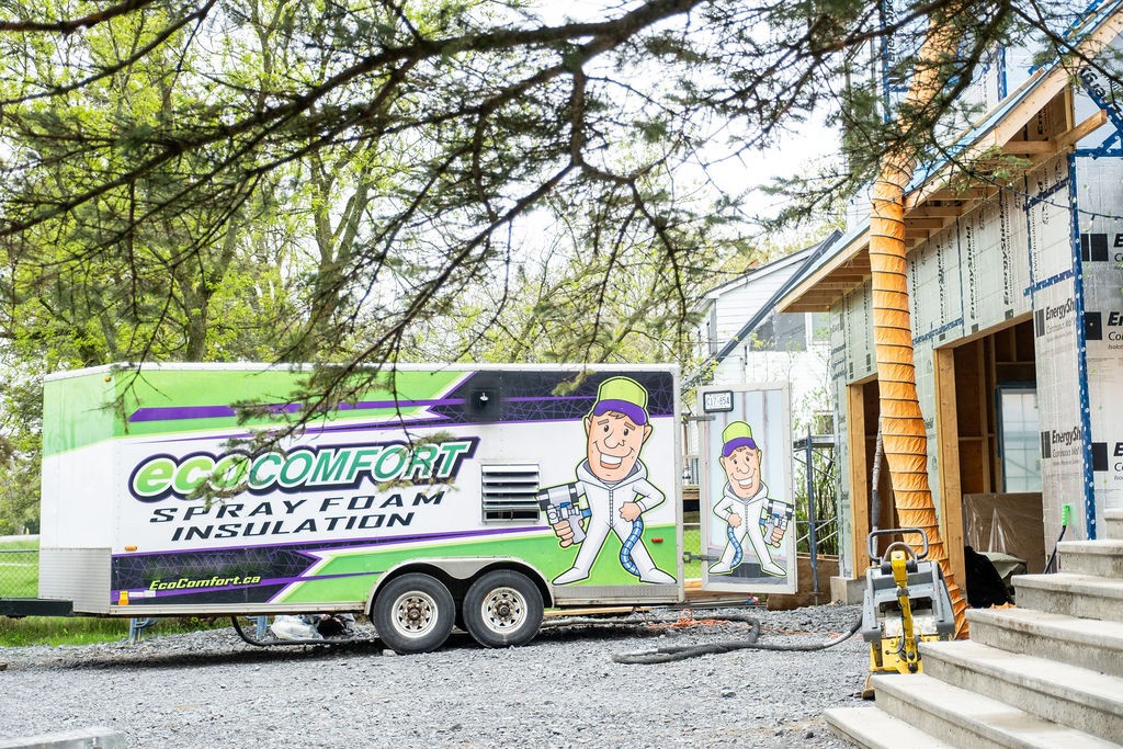 Spray foam truck parked outside of house in Kingston